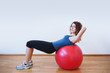 © pio3 - Young woman exercise with ball in the gym.