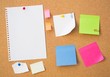 © Proxima Studio - Colour note papers on pin board. Cork background