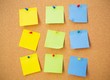 © Proxima Studio - Colour note papers on pin board. Cork background