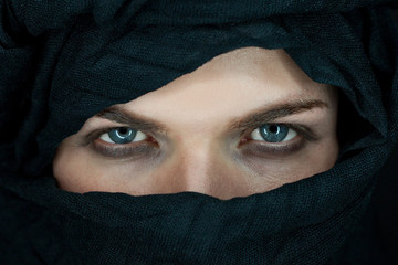 eyes of a beautiful man with black scarf