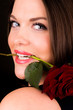 You beautiful female with a rose in her mouth
