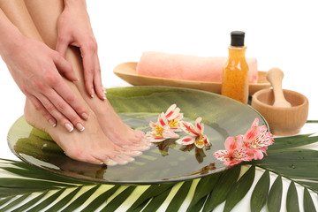 Canvas Print - Female feet in spa bowl with water, isolated on white