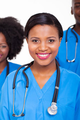 Wall Mural - female african nurse with colleagues on background