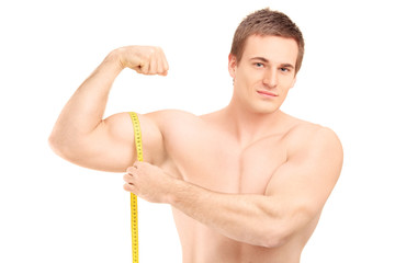 Sticker - Fit shirtless guy measuring his muscle