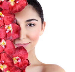 Woman with orchid flowers on face