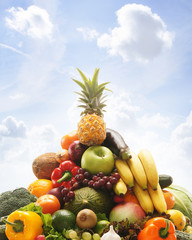 Pile of fresh and tasty fruits and vegetables isolated on white