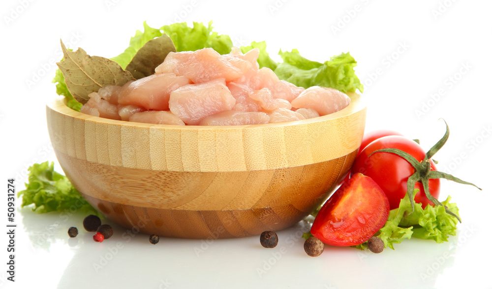 raw chicken meat in wooden bowl, isolated on white