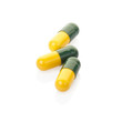 Pill and colorful medical capsule on white with clipping path