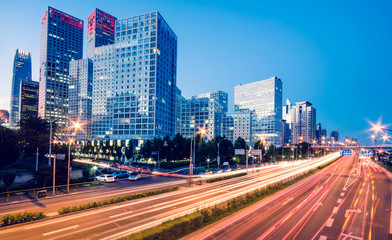 light trails on the modern city at dusk in beijing,China