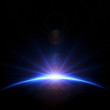 © JohanSwanepoel - Earth sunrise with rays and lens flare