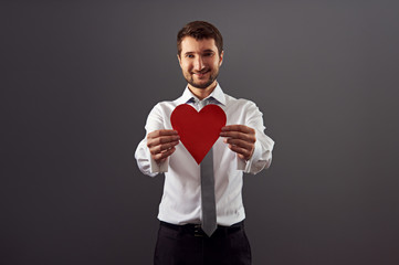 Canvas Print - handsome man showing red heart