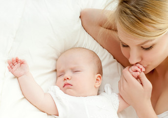 happy mother with baby over white