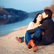 © Viktor - Young attractive couple in love posing in cold spring