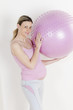 © Richard Semik - portrait of pregnant woman doing exercises with a ball