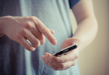 Wall Mural - A man using a mobile phone