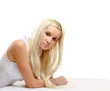© lenets_tan - Portrait of a smiling young woman lying on the floor