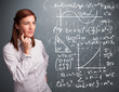 © ra2 studio - Beautiful school girl thinking about complex mathematical signs