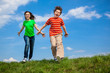 © Jacek Chabraszewski - Girl and boy running, jumping outdoor