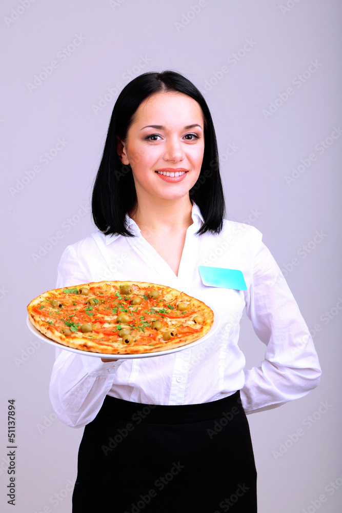 Beautiful girl waiter with pizza isolated on white