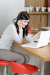 © Studio-FI - Woman using her laptop at home