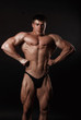 © Alona Dudaieva - Young attractive man in a black bathing suit bodybuilder