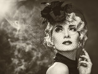 Wall Mural - Elegant blond retro woman  wearing little hat