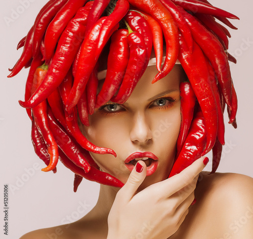 Plakat na zamówienie Hot Chili Pepper on Shiny Woman's Face. Creative Concept