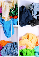 Clothing scattered on shelves