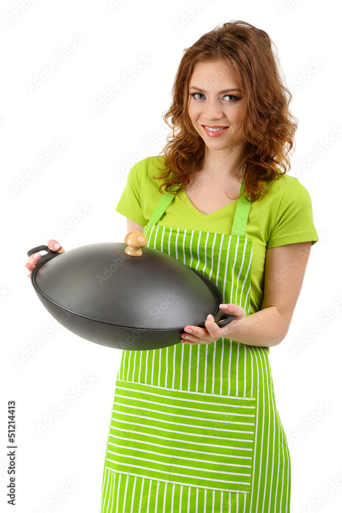 Young woman wearing kitchen apron with wok pan, isolated