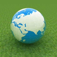 Earth on green grass. Abstract 3d illustration