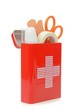 An open travel first aid kit standing on a white background