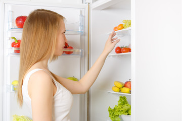 girl near the refrigerator