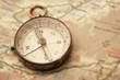 Old compass on map
