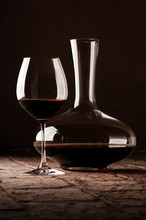 Red Wine In Decanter On Rustic Stone Floor