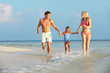 © Monkey Business - Family Having Fun In Sea On Beach Holiday