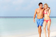 © Monkey Business - Romantic Couple Walking On Beautiful Tropical Beach