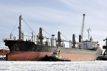 Cargo ship moored to port in the winter time