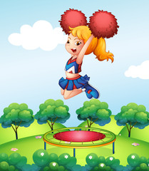 Sticker - A cheerdancer holding her red pompoms above the trampoline