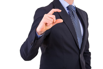 Businessman gesturing small size with fingers.