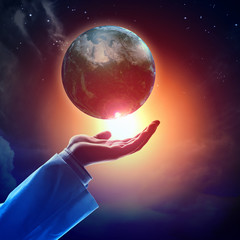 Wall Mural - image of earth planet on hand