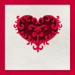 card with a red heart made ​​of paper on a white background