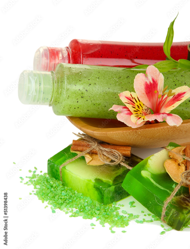 Bottles with scrub and hand-made soap, isolated on white