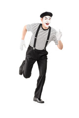 Sticker - Full length portrait of a mime artist running and looking at cam