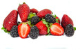 Bilberries, blackberries and strawberries on white