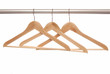 Empty wooden hangers are on white background.