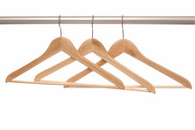 Empty Wooden Hangers Are On White Background.