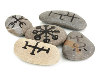 Fortune telling  with symbols on stones isolated on white