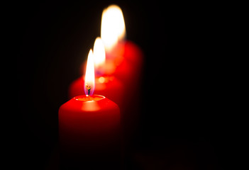 Red candles with black background