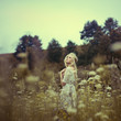© VectorART - Vintage photo of beautiful girl in spring field