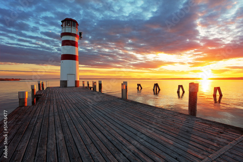 Naklejka dekoracyjna Lighthouse at Lake Neusiedl at sunset